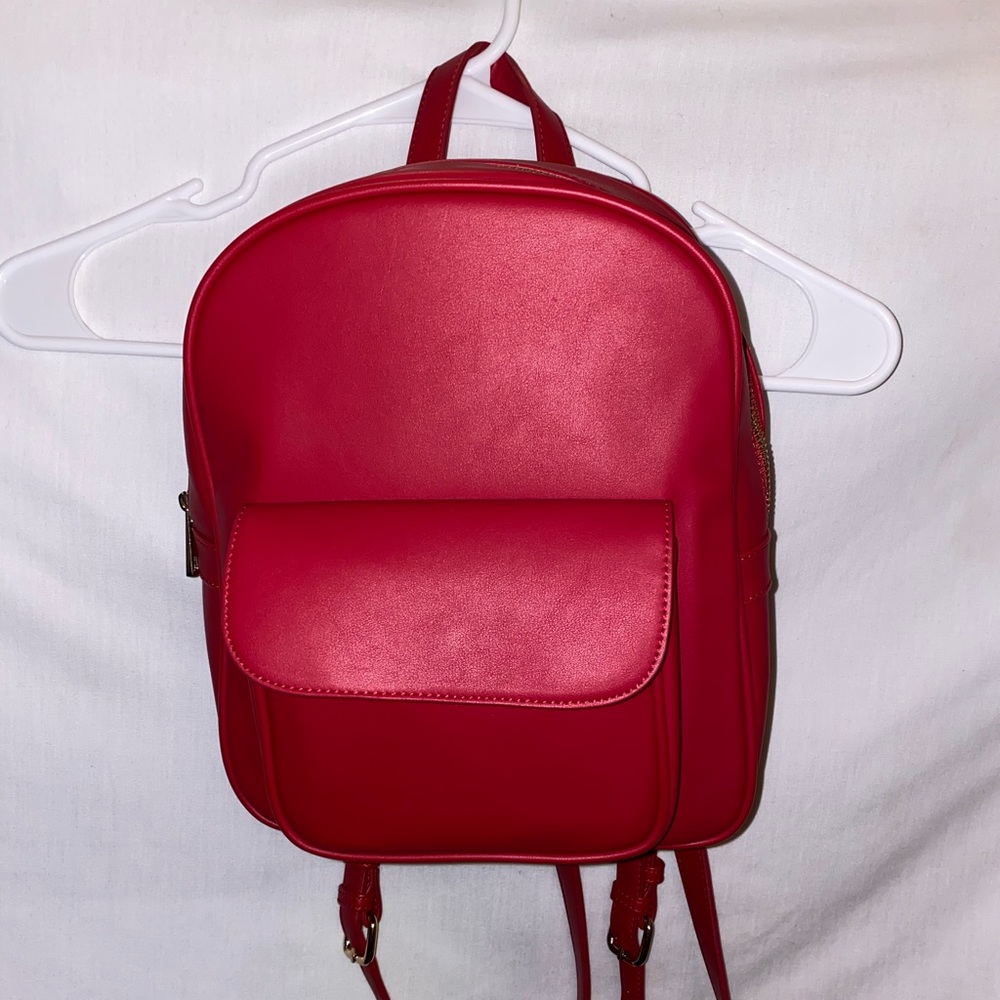 Red faux leather mini backpack
